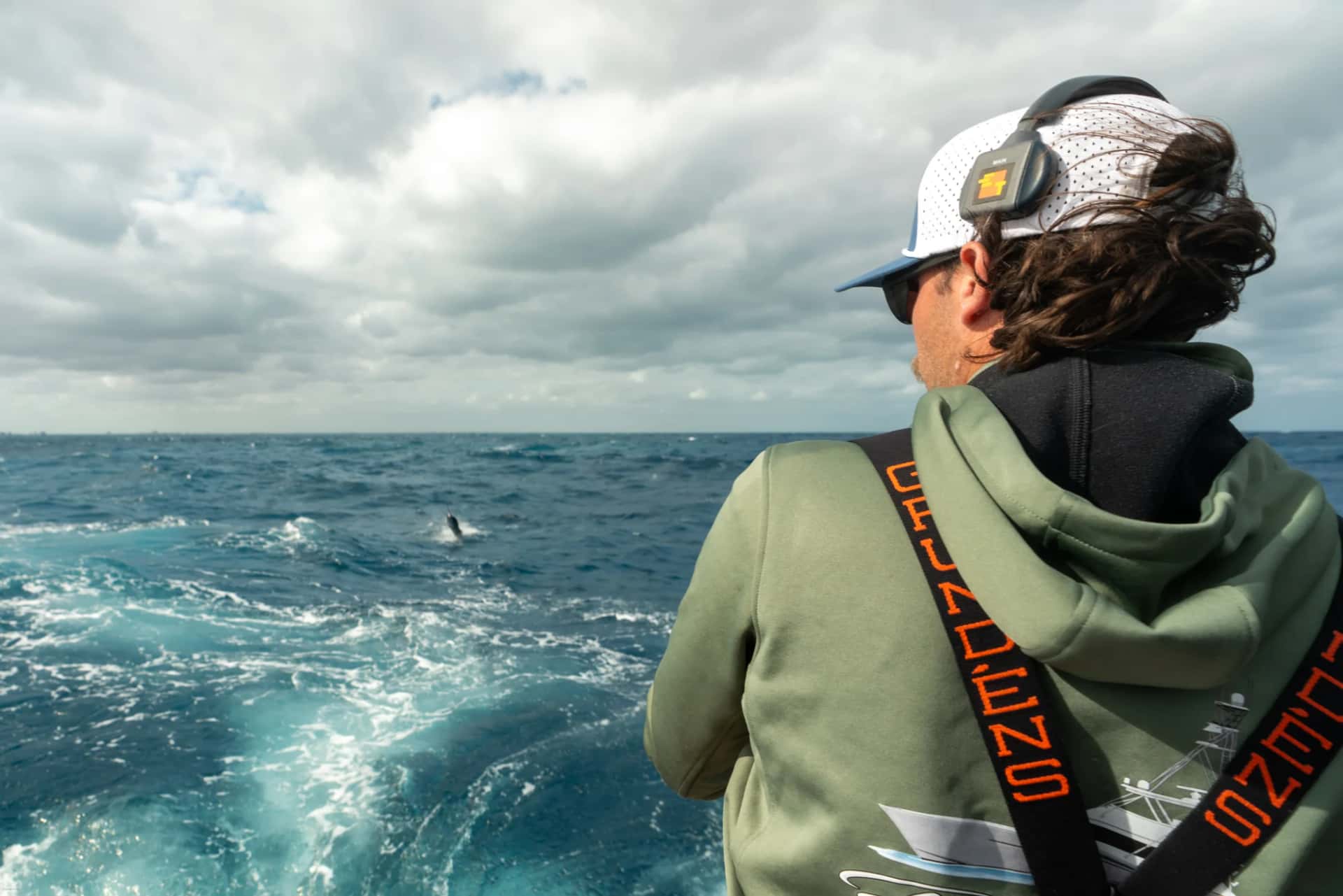Angler watching ocean wake during tournament